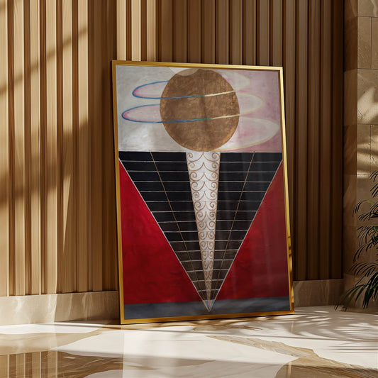 Abstract art piece with geometric design in a gold frame against a striped wall.