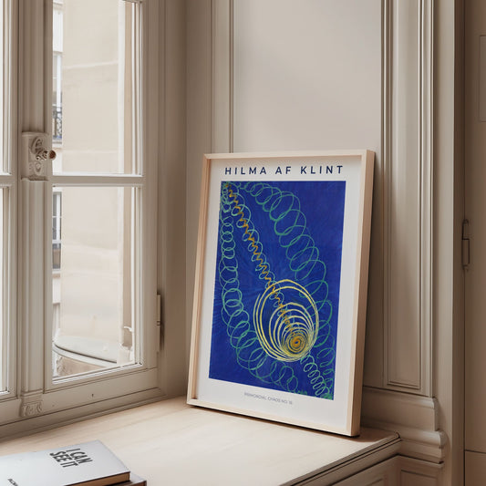 Framed artwork by Hilma af Klint on a windowsill with a neutral background