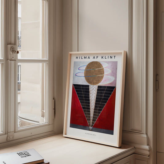 Framed artwork by Hilma af Klint on a windowsill with a neutral background