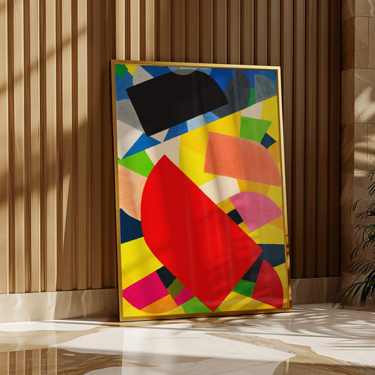 Colorful abstract art piece in a gold frame on a wall.