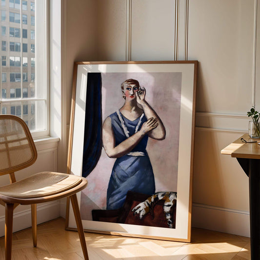 Framed painting of a woman in a blue dress leaning against a wall with a chair and table in the foreground.