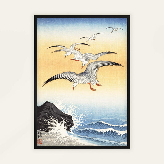 Five Seagulls Above Turbulent Sea by Ohara Koson. Framed artwork of seagulls flying over waves with a rocky outcrop.