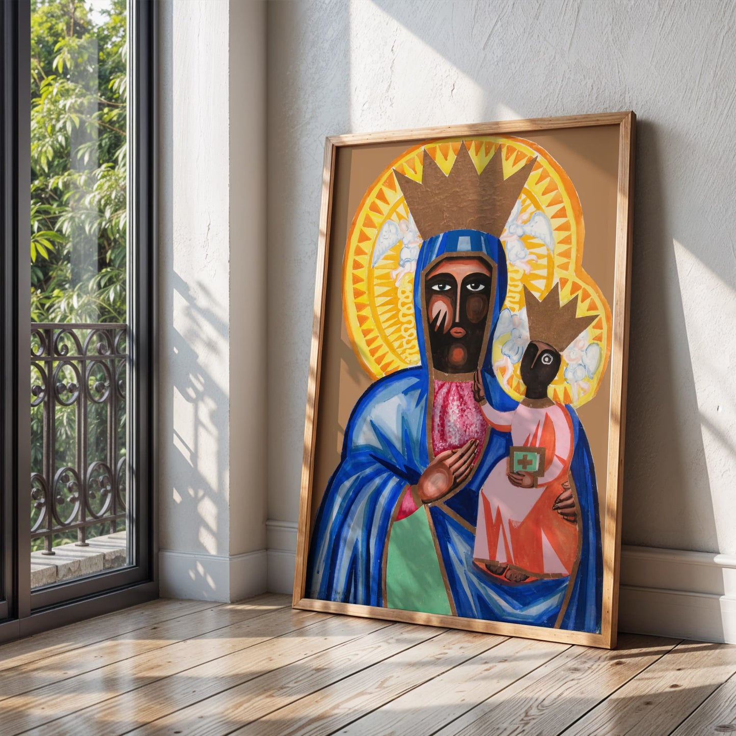 Framed artwork of a religious figure holding a child in a room with a window and wooden floor.