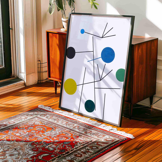 Abstract art piece on a wooden floor with a rug and furniture in the background. Rising, Falling, Clinging, Flying by Sophie Taeuber-Arp