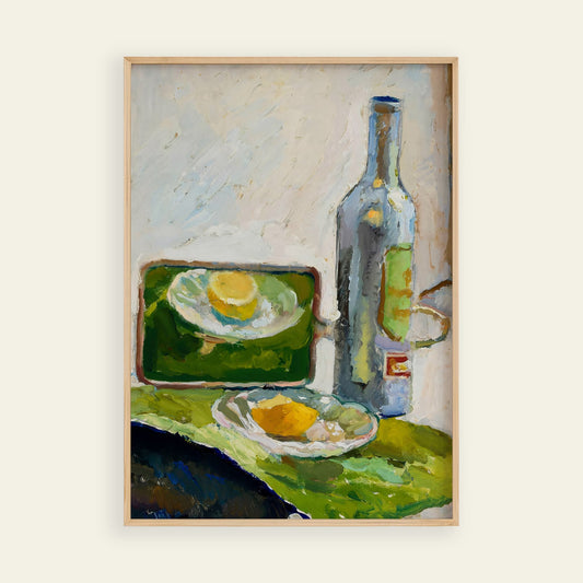 Framed painting of a still life scene with a bottle, plate, and lemon on a green surface.