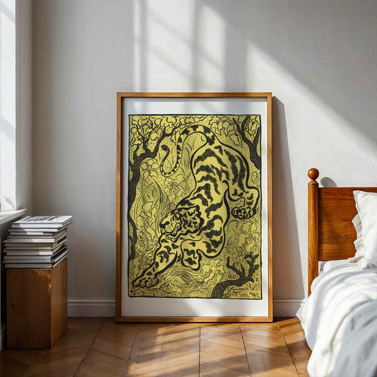 Framed artwork of a tiger in a room with wooden furniture and white walls. Tiger in the Jungle by Paul Ranson.