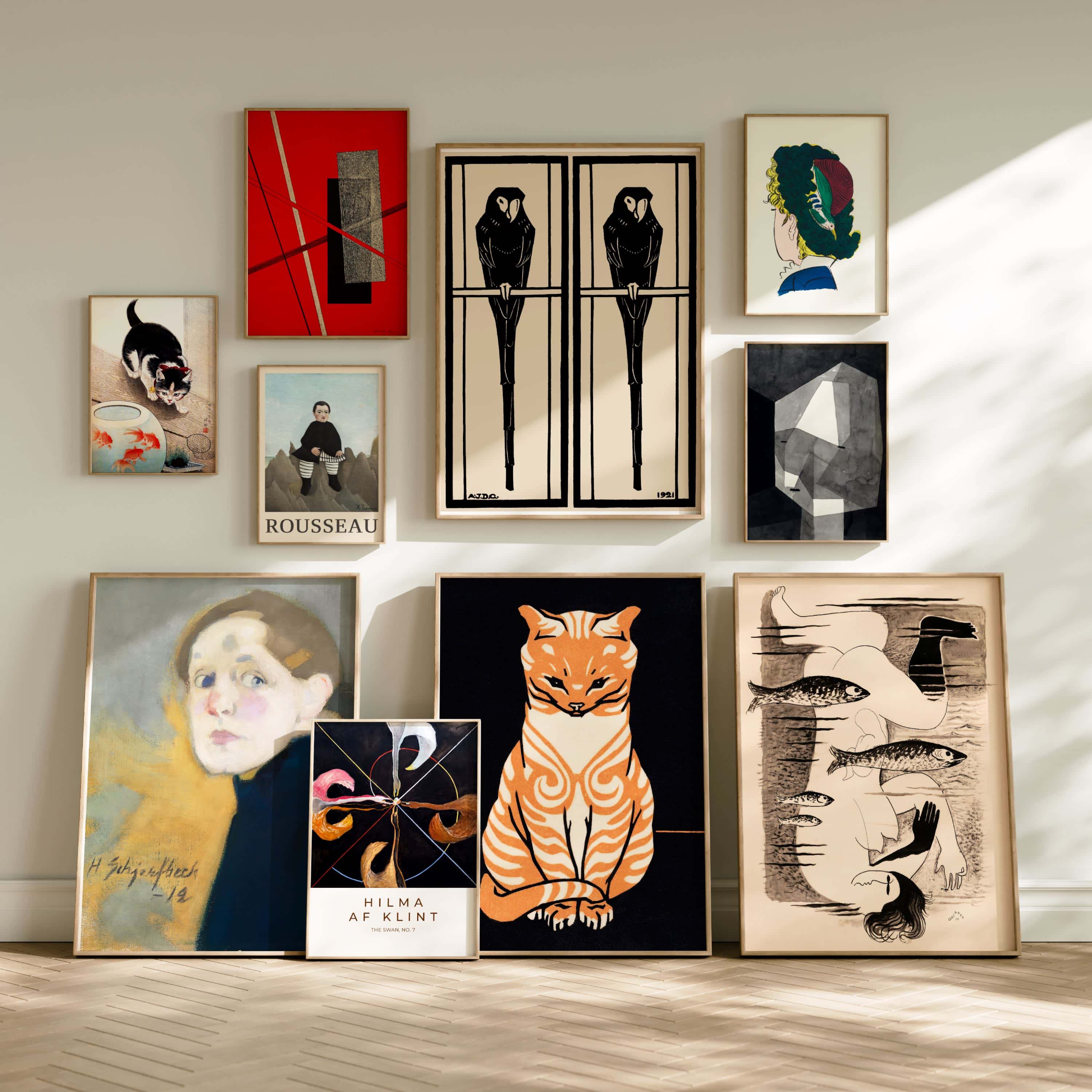 Collection of framed artworks on a wall